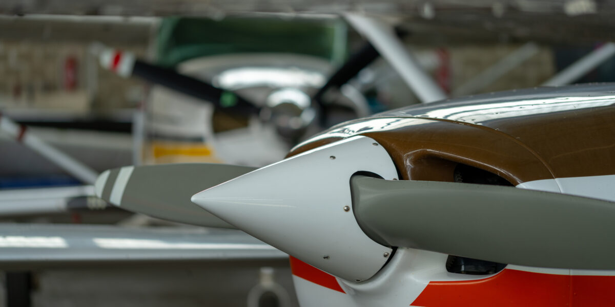 Small Sport Aircraft parked in hangar, close up. detail